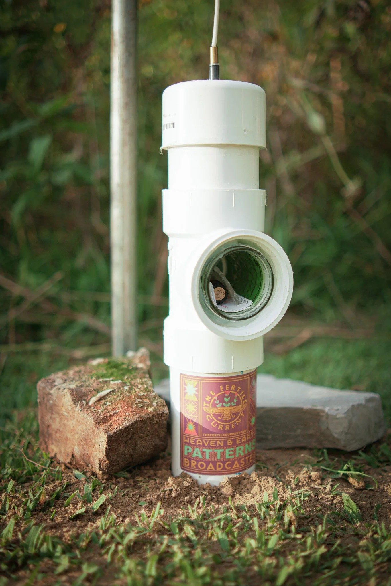 Heaven & Earth Patterns Soil Broadcaster installed in the field, paired with a CW2+ antenna and installation kit